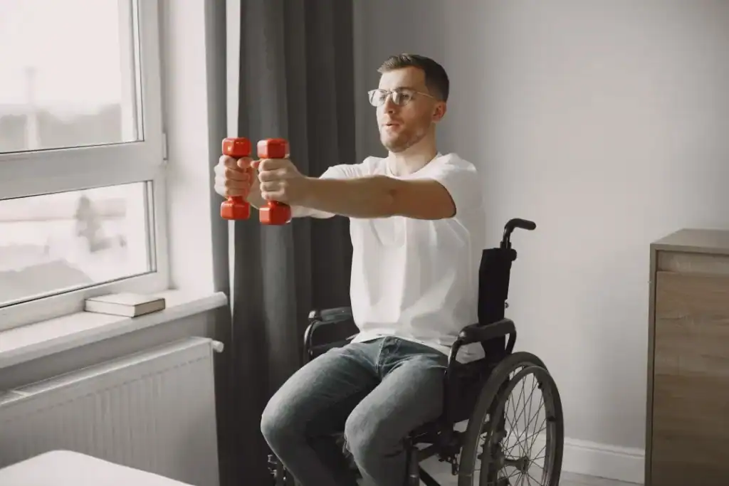 Image of man doing exercise in his wheelchair to aid weight loss Ashtead
