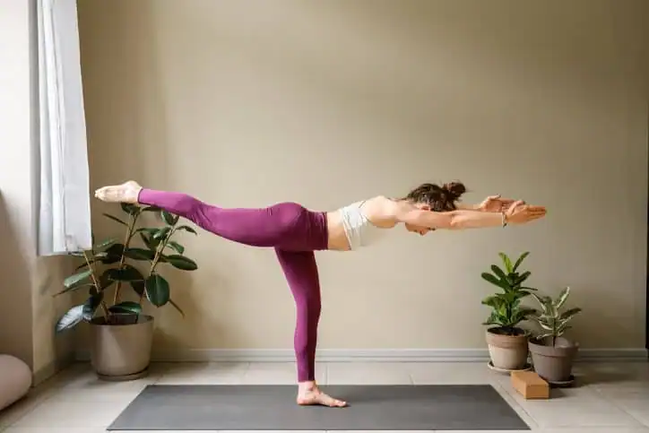 Woman doing Yoga exercise Ashtead to help with toning the body. 