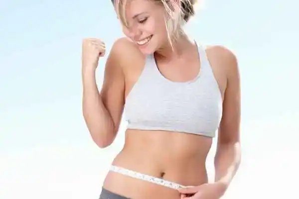Unraveling the Mystery: Where Does the Body Fat Loss From First? 3 Image of woman happy with fat loss Ashtead